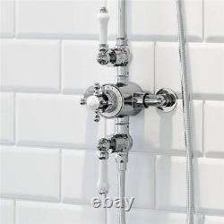 Mélangeur thermostatique de douche traditionnel en chrome avec valve à croix et pommeau rond de pluie.